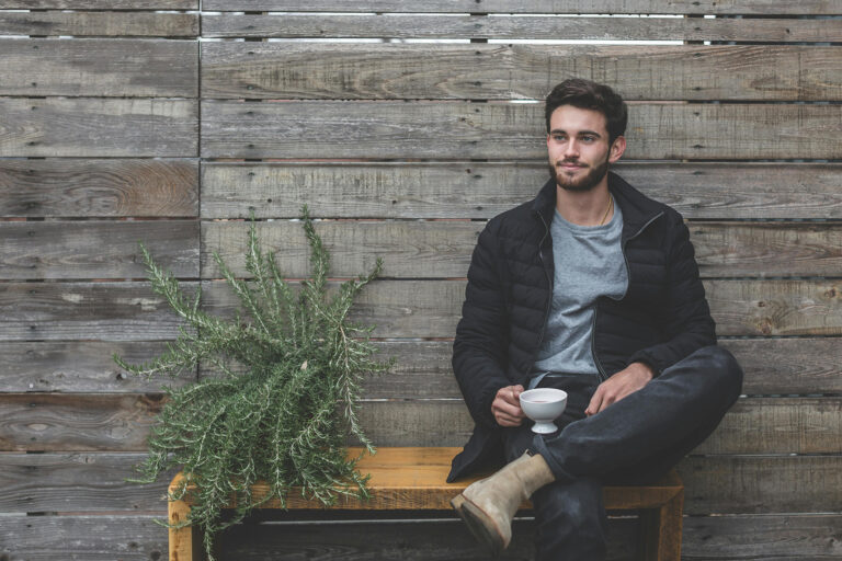 Man sits with coffee thinking about male infertility in San Antonio, TX